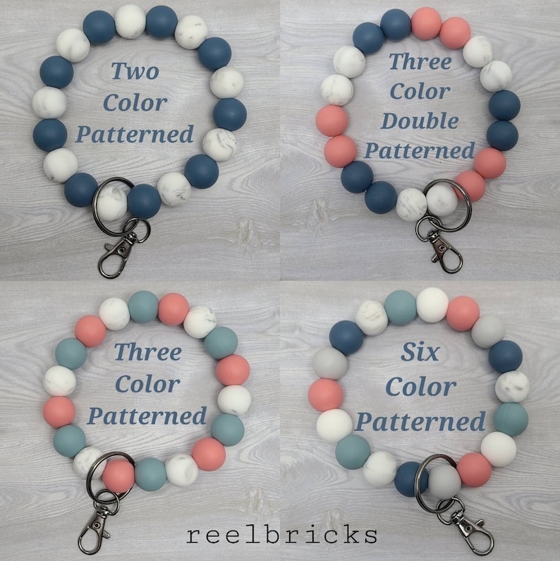 May include: Four silicone beaded keychains in different color combinations. The keychains are made with blue, white, gray, and pink beads. The beads have a marble pattern. The keychains are labeled with the number of colors used and the word "patterned".
