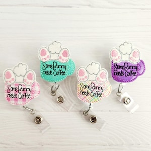 May include: Three bunny-themed badge holders with the text "Some Bunny needs Coffee" on each. The badge holders are in pink, green, and purple.
