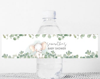 May include: Water bottle label with a watercolor design of eucalyptus leaves and a cute elephant. The label says "Samantha's Baby Shower".