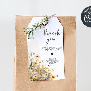 a brown paper bag with a thank you tag on it
