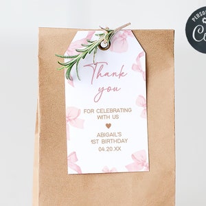 a brown paper bag with a thank you tag on it