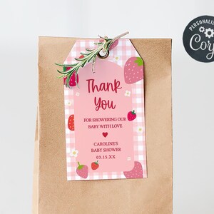 a brown paper bag with a thank you note attached to it