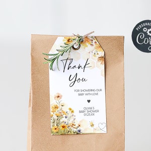 a brown paper bag with a tag that says thank you