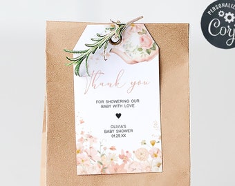 May include: A brown paper bag with a thank you tag attached. The tag has a floral design and the text "Thank you for showering our baby with love Olivia's Baby Shower 01.25.30".