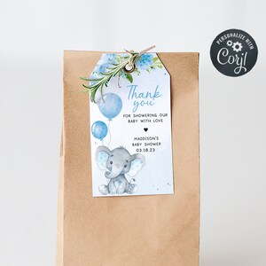 May include: A blue and gray thank you tag with an elephant holding balloons. The tag says "Thank you for showering our baby with love" and includes the date "03.18.23".