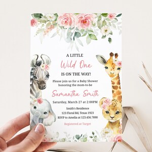 May include: A baby shower invitation with a pink floral design and illustrations of a zebra, elephant, giraffe, and lion. The text reads "A Little Wild One Is On The Way!" and includes the name "Samantha Smith", the date and time of the shower, the location, and RSVP information.