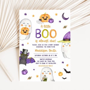 May include: A Halloween-themed baby shower invitation with watercolor illustrations. The design features ghosts, pumpkins, bats, and the text "A little BOO is almost due!" The invitation includes event details and RSVP information.