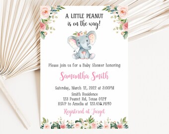 May include: A baby shower invitation with a watercolor illustration of a gray elephant with pink floral accents. The text reads "A Little Peanut is on the way!" and includes details for the event, including the date, time, location, and RSVP information. The invitation also states that the event is registered at Target.