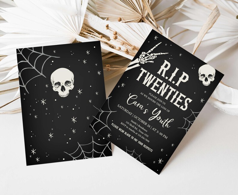 a black and white halloween party with a skull on it