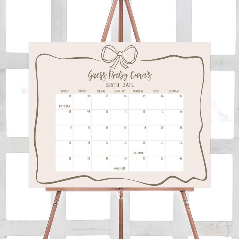 a calendar on a easel with a bow on it
