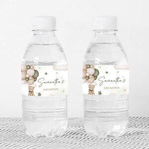 a bottle of water with a teddy bear on it