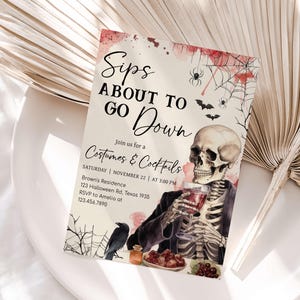 The image is a Halloween-themed invitation card with a skeleton holding a drink and a spider web design.