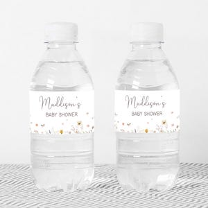 a bottle of water with a baby shower label on it