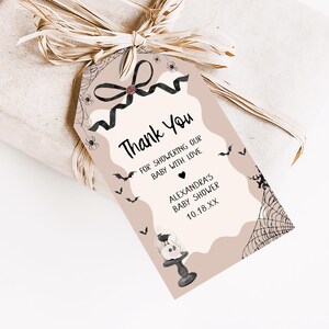 a gift wrapped in brown paper with a tag on it