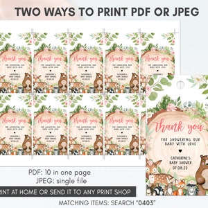 May include: Ten printable thank you tags featuring a woodland theme with a brown bear, deer, fox, and other woodland creatures. The tags are decorated with pink flowers and greenery. The text on the tags reads "Thank you for showering our baby with love."  The tags are designed for a baby shower.