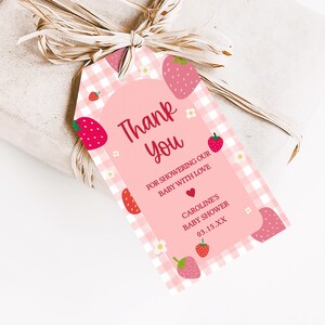 a pink thank you tag with strawberries on it