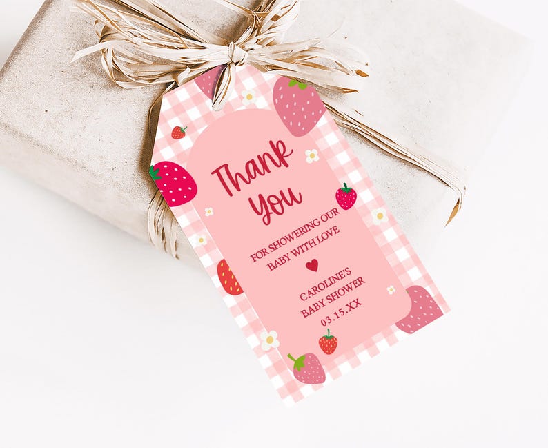 a pink thank you tag with strawberries on it