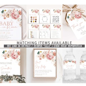 May include: A set of printable baby shower decorations featuring a floral theme. The decorations include an invitation, welcome sign, don't say baby sign, water bottle labels, and a thank you tag. The floral design features pink and white flowers with green leaves.