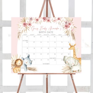 May include: A pink and white baby shower game with a calendar for guests to guess the baby's birth date. The calendar is decorated with floral and animal illustrations, including a giraffe, elephant, lion, and rhinoceros. The text on the calendar reads "Guess Baby Alexandra's Birth Date".