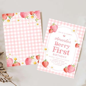 a pink and white checkered paper with strawberries on it