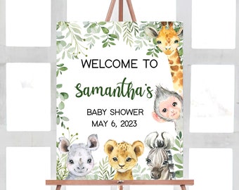 May include: Welcome to Samantha's Baby Shower on May 6, 2023. A white sign with green foliage border features a giraffe, monkey, lion, zebra, and rhinoceros.