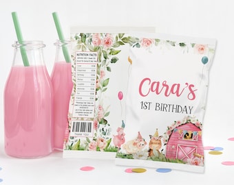 May include: White favor bag with a pink barn, farm animals, and flowers. The bag has the text "Cara's 1st Birthday" printed on it.