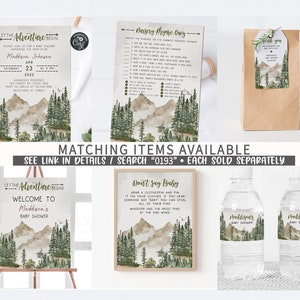 May include: A set of printable baby shower decorations with a woodland theme. The decorations include a welcome sign, a game card, a favour bag, and water bottle labels. The design features a watercolour background with mountains, trees, and a light brown colour scheme.