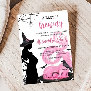 May include: A baby shower invitation with a witch theme. The invitation features a silhouette of a pregnant witch wearing a hat, with the text "A Baby is Brewing." The invitation includes the name "Alexandra Smith" and event details.