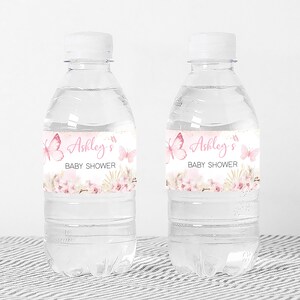 a bottle of water with a baby shower label on it