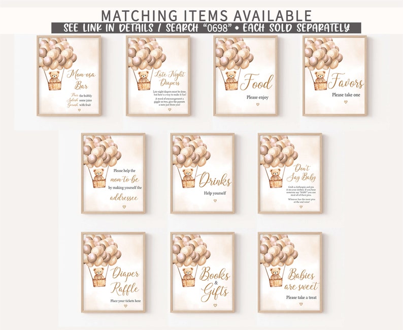 May include: Ten printable signs with a teddy bear in a hot air balloon design. The signs are for a baby shower and include titles like "Mon esa Bar", "Late Night Diapers", "Food", "Favors", "Drinks", "Don't Say Baby", "Diaper Raffle", "Books & Gifts", and "Babies are Sweet".