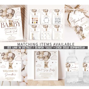 May include: A set of printable baby shower decorations featuring a teddy bear holding balloons in a cloud with stars. The set includes a welcome sign, a don't say baby sign, water bottle labels, and a thank you tag. The decorations are in a neutral color palette of brown, beige, and white.