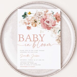 a baby in bloom card on a plate