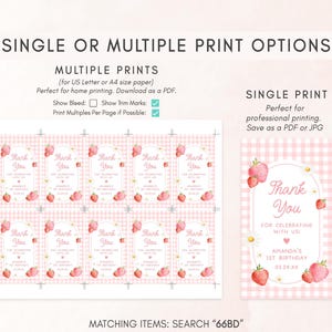 a pink and white checkered table cloth with strawberries on it