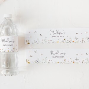 a bottle of water next to a baby shower bottle