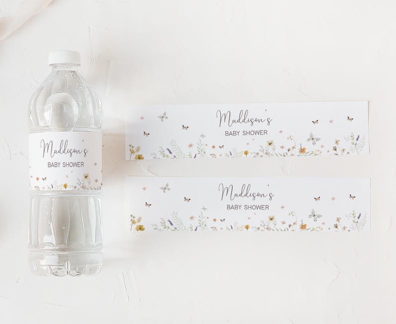 a bottle of water next to a baby shower bottle