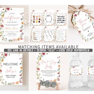 May include: A set of printable baby shower decorations with a floral theme. The decorations include a welcome sign, a don't say baby sign, a thank you tag, and water bottle labels. The text on the signs reads "Welcome to Ashley's Baby Shower" and "Don't Say Baby".