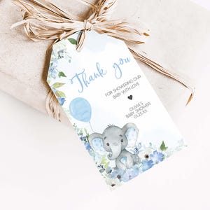 a gift wrapped in brown paper with an elephant tag