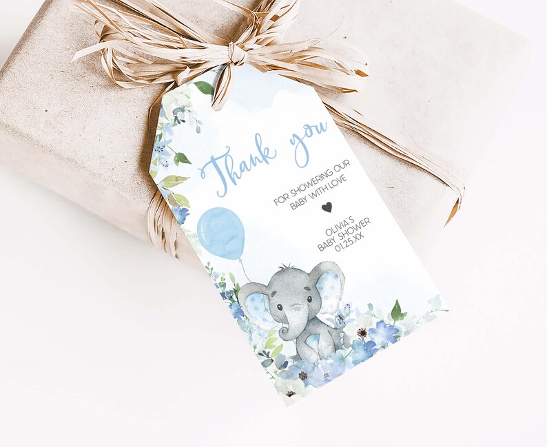 a gift wrapped in brown paper with an elephant tag
