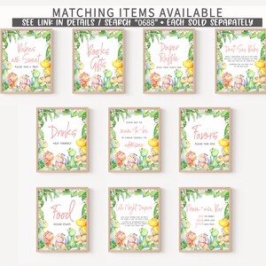 May include: Nine printable signs with a jungle theme featuring dinosaurs and greenery. The signs have text that says "Babies are Sweet", "Books & Gifts", "Diaper Raffle", "Don't Say Baby", "Drinks", "Please Help the Mom-to-be", "Favors", "Food", "Late Night Diapers", and "Mom-osa Bar".