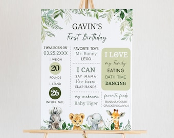 May include: A green and white printable first birthday sign for a boy named Gavin. The sign features a jungle animal theme with illustrations of a zebra, lion, elephant, and giraffe. The sign includes information about Gavin's age, weight, height, favorite toys, foods, and activities.