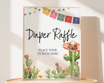 May include: A white sign with the text "Diaper Raffle" in black script font. The sign is decorated with colorful paper flags, a cactus with a sombrero, and green cacti with pink flowers. The text "Place your tickets here" is below the main text.