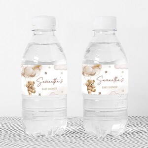 a bottle of water with a teddy bear label on it