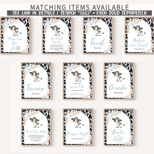 May include: Set of ten printable signs for a baby shower. Each sign features a cute cartoon cow with black and white spots and blue accents. The signs include titles such as "Momosa Bar", "Little Night Diapers", "Food", "Babies are Sweet", "Favors", "Please help the mom-to-be by making yourself the addressee", "Drinks", "Don't Say Baby", "Diaper Raffle", and "Books & Gifts".