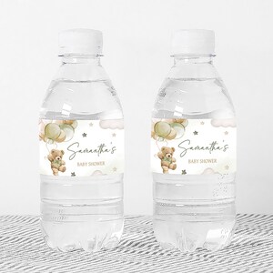 a bottle of water with a teddy bear on it