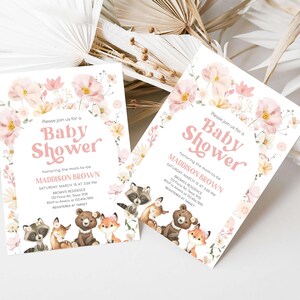 a couple of baby shower cards sitting on top of a table