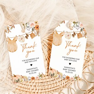 two thank you cards sitting on top of a wicker basket