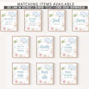 May include: Set of nine printable signs for a baby shower with a nautical theme. The signs feature a blue whale with white stars and a variety of sea creatures. The signs include "Mom-to-be Address", "Diaper Raffle", "Books & Gifts", "Drinks", "Food", "Favors", "Don't Say Baby", "Babies are Sweet", and "Late Night Diapers".