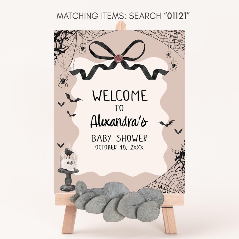 a welcome sign for a baby shower with rocks