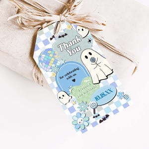 a gift wrapped in brown paper with a tag on it