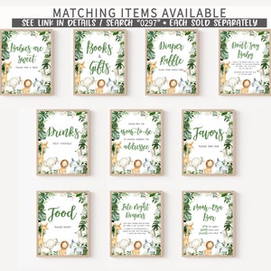 May include: A set of ten printable signs for a jungle-themed baby shower. The signs feature a variety of jungle animals, including a lion, giraffe, and zebra. The signs are decorated with green leaves and flowers. The text on the signs includes "Babies are Sweet", "Books & Gifts", "Diaper Raffle", "Don't Say Baby", "Drinks", "Mom-to-be Address", "Favors", "Food", "Late Night Diapers", and "Mom-osa Bar".